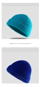 Detailed close-up showing the blue knitted texture and fine craftsmanship of the beanie