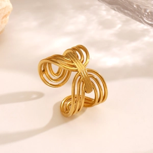 Golden wavy layered open ring in stainless steel with minimalist geometric design