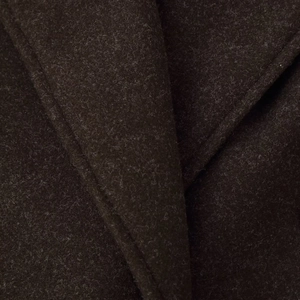 Close-up of thick textured wool blend fabric on a classic British style autumn winter coat