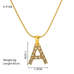 Macro shot of gold 'A' letter pendant necklace with cubic zirconia and size dimensions