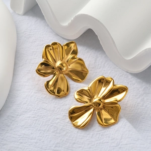 Detailed macro view of 18K gold plated flower earrings with elegant radial petal texture