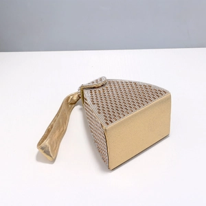 Detail of golden triangle evening clutch with sparkling rhinestones and wrist strap