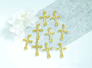Detailed set of nine 18K gold-plated religious cross pendants with embossed textures