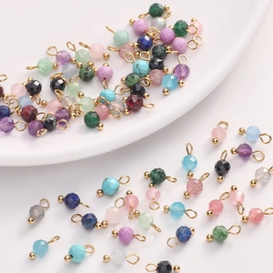Detailed view of 4mm faceted natural stone pendants and beads for DIY jewelry making
