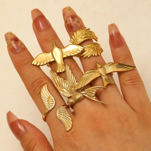 5-piece gold stainless steel ring set featuring vintage flying bird and wing designs