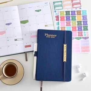 2026-2027 18-month faux leather planner with colorful index tabs and white gel pen