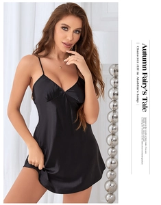 Detail of elegant black satin nightgown with deep V-neck and delicate straps