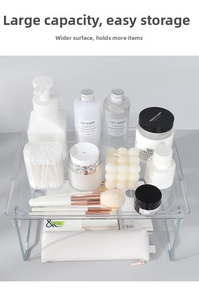 Macro shot of a clear acrylic desk organizer with metal legs holding skincare and cosmetics