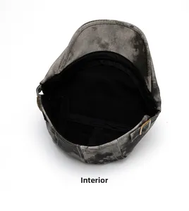 Detail view of washed grey beret cap showing internal lining and adjustable metal buckle