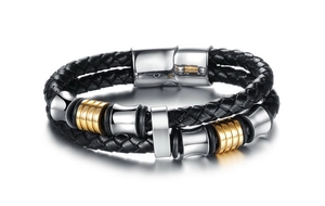 Close-up of black braided leather bracelet with gold and silver magnetic clasp