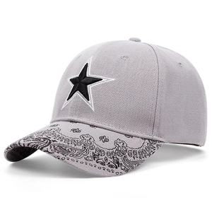 Light gray cotton baseball cap featuring a black star logo and paisley patterned brim