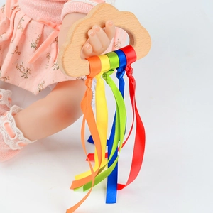 Rainbow beech wood baby sensory teether toy with colorful ribbons on white background