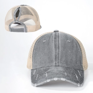 Close-up of ponytail baseball cap featuring washed gray fabric and breathable beige mesh