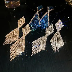 Sparkling tassel drop earrings set in blue, gold, and white with geometric rhinestones