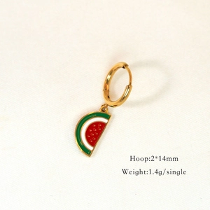 Macro shot of 14mm gold hoop earrings featuring colorful watermelon enamel pendants