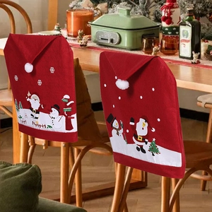 Set of 2 red Christmas chair covers with festive Santa and snowman motifs for dining decor