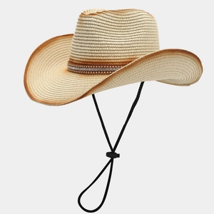 Detail of retro straw cowboy hat featuring sunflower band and brown gradient brim edges