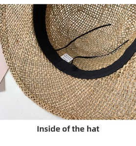 Detail of 100% natural straw hat interior featuring black sweatband and adjustable drawstring