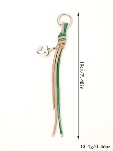 Detail view of woven leather keychain with heart charm, 19cm length and 13.1g weight