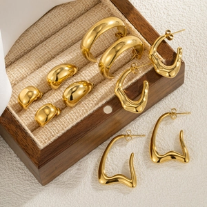 Minimalist vintage gold plated semi-circle stud earrings set on wooden display box