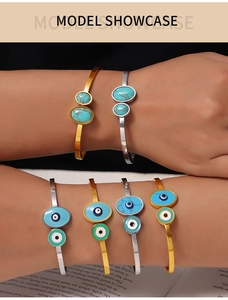 Detail view of bohemian titanium steel bangle featuring turquoise stone and evil eye design