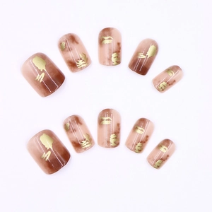 Brown gradient short press-on nails with golden glitter foil and leaf art patterns
