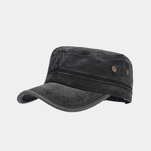 Detail view of washed cotton cadet cap with metal eyelets and vintage stitched texture