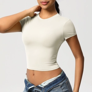 Close-up of a cream slim-fit crop top sport T-shirt with high elasticity fabric