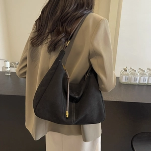 Retro black suede Hobo bag with brown strap and fringe tassel for commute and daily use