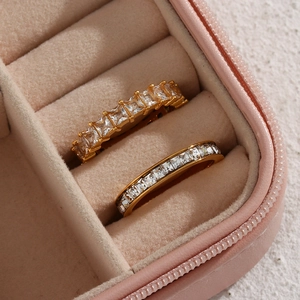 Elegantly set 18K gold plated eternity rings with sparkling zircons in a pink jewelry case