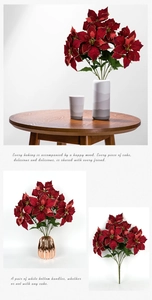 Detail of red artificial poinsettia with gold glitter edges for Nordic home decor