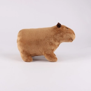 Detailed side view of soft light brown capybara plush toy with smooth short fur texture