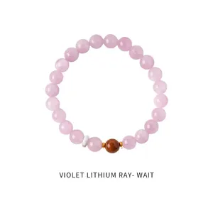 Detail shot of violet lithium quartz beaded bracelet with brown cat-eye stone accents