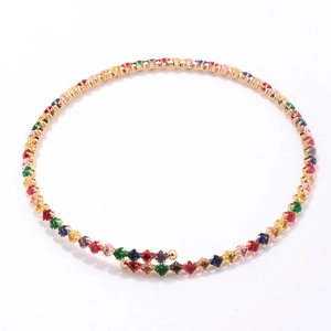 Macro view of colorful square-cut zircon tennis necklace with a golden metal setting