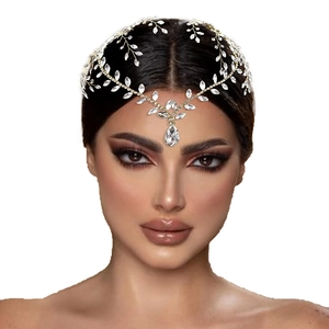 Elegant gold bridal headpiece with crystal leaves and a teardrop rhinestone pendant
