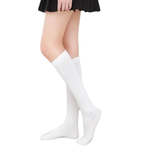 Detail of white cotton knee-high socks featuring a ribbed knit texture and comfortable fit