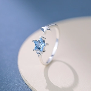 Elegant S925 sterling silver open ring featuring blue star zircon and solid silver star