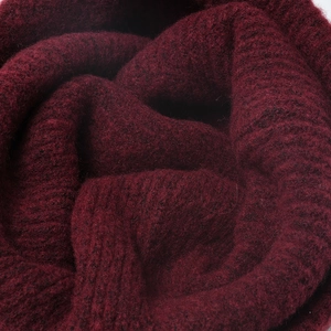 Classic burgundy ribbed knit beanie hat made of warm thickened wool for winter outdoors