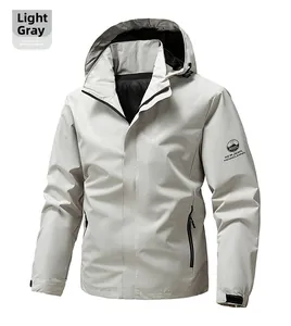Detailed view of adjustable cuff and logo on light grey hooded outdoor jacket