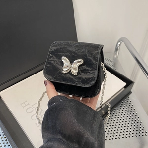 French style black faux leather crossbody bag with silver butterfly buckle and chain strap