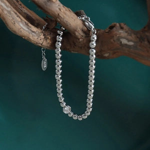 Silver beaded bracelet with zircon pendant on wood branch, minimalist 18K plated jewelry