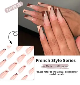 Detail of long coffin press-on nails with nude base and brown French color-block design