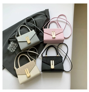 Top view of sequined crossbody bags in grey pink cream and black with metallic locks