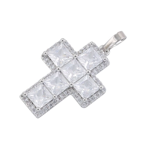 Macro shot of silver cross pendant with square zircon and micro-pave crystals