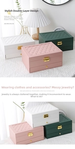 Detail of double-layer leather jewelry box featuring quilted top and metal lock