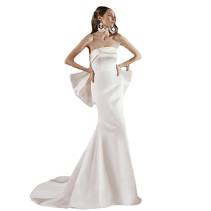 Elegant strapless satin mermaid wedding dress with oversized bow detail on back