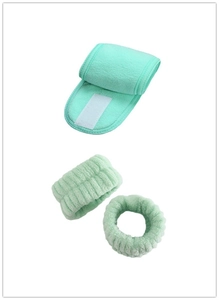 Detail of mint green spa headband and wristband set with soft plush texture