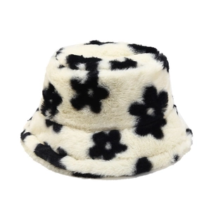 Winter plush bucket hat with retro black floral pattern on soft off-white faux fur