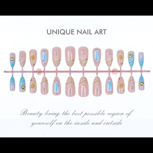 Detail of 24pcs almond press-on nails with 3D ocean shells, pearls and wave textures