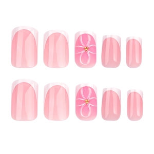 Short square French press-on nails with pink blush base and 3D white flower design